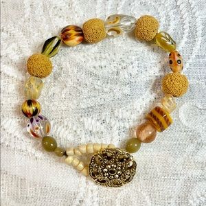 Boho style bracelet in lava, acrylic, glass, and wood beads 9”